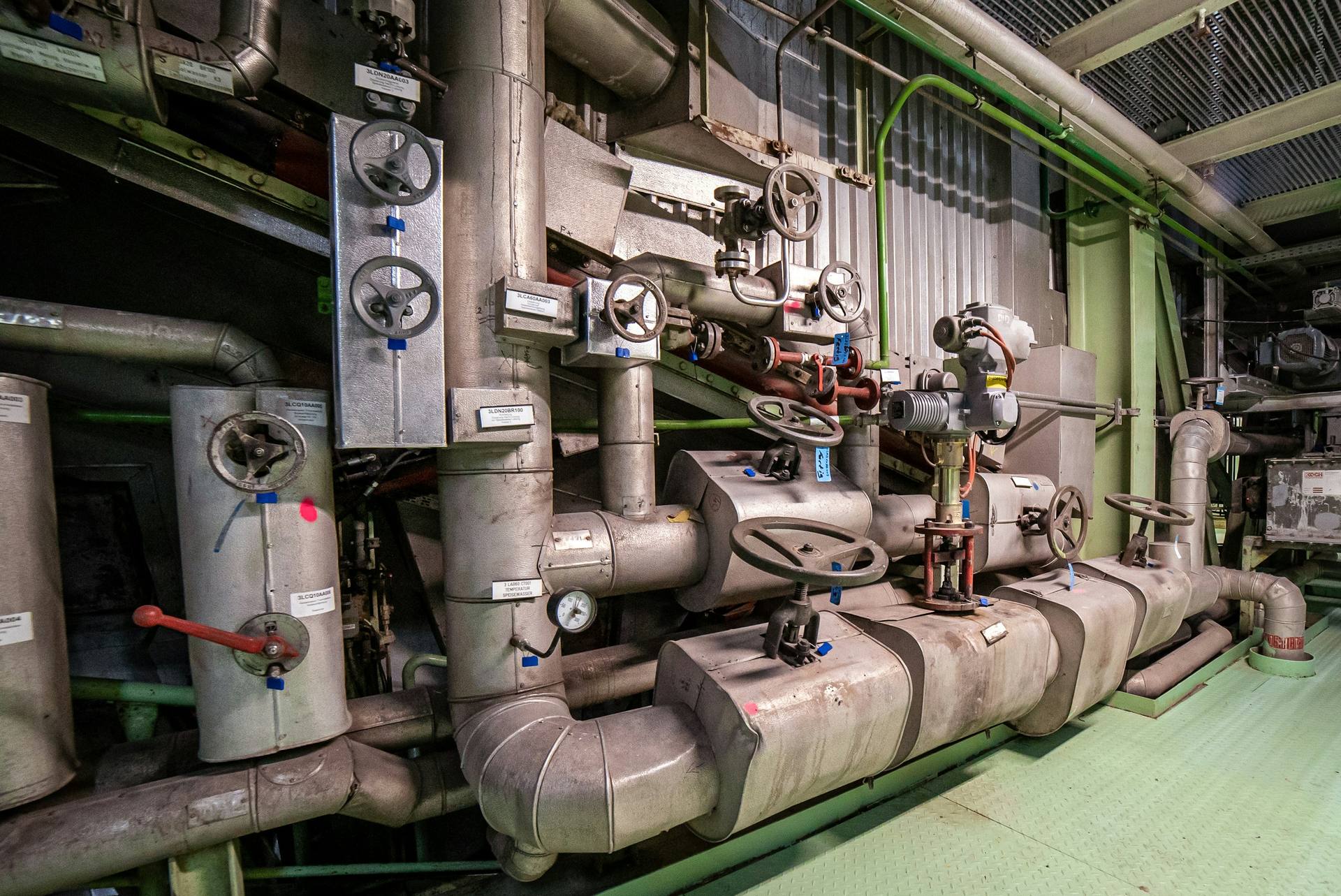Insulated pipework and valves in a plant room